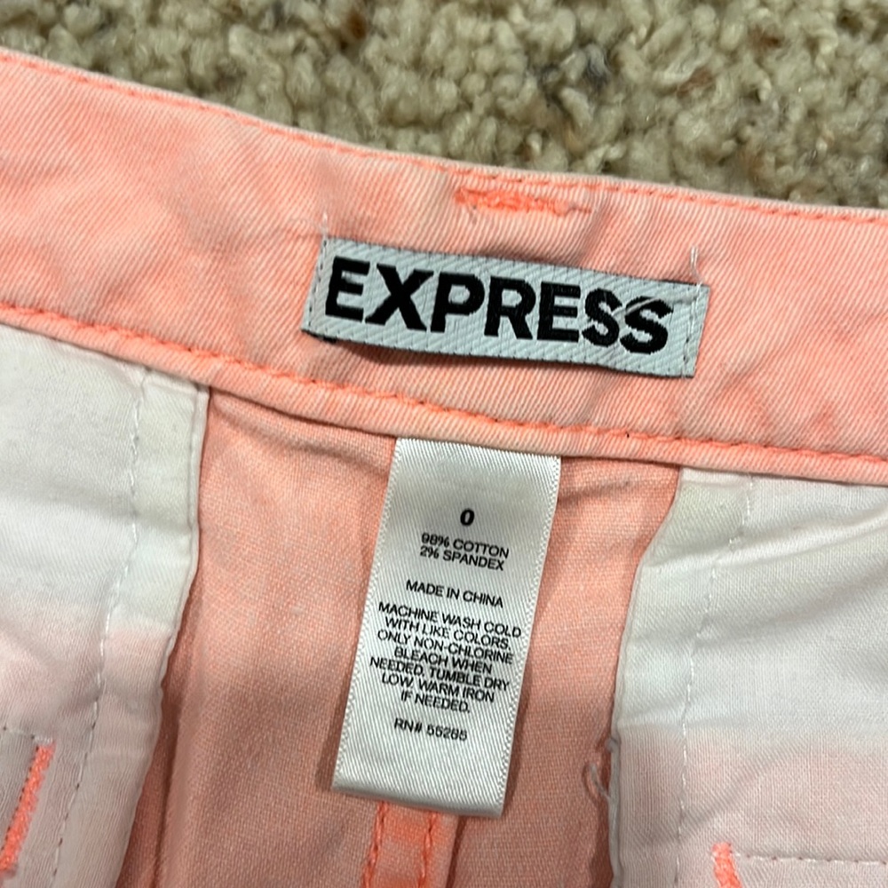 Express size 0 shorts in a cute light orange / salmon like color!